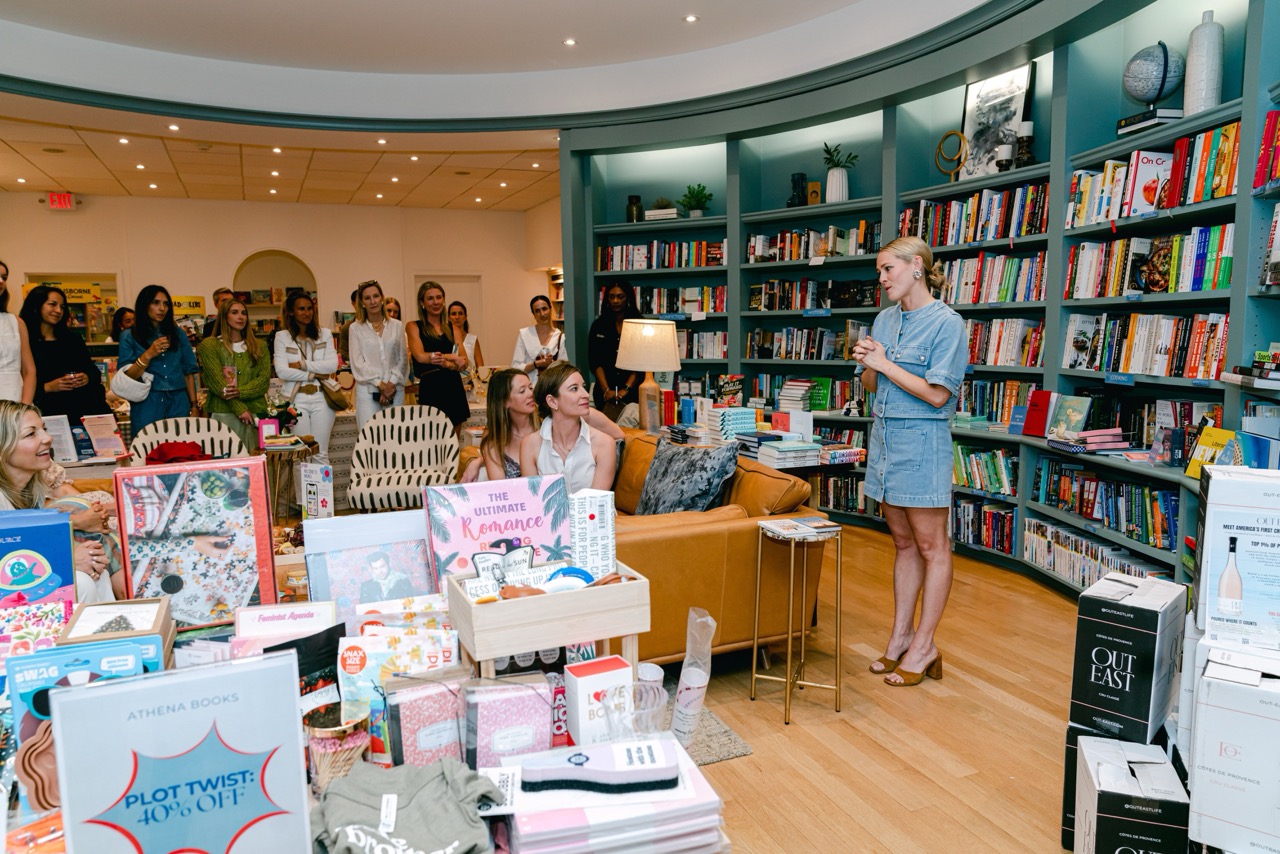 Moxies founder speaking to guests gathered at the Greenwich product launch in a bookstore setting.